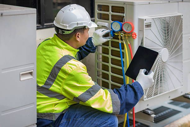 Professional Hvac technician working in Mansfield Center, MA